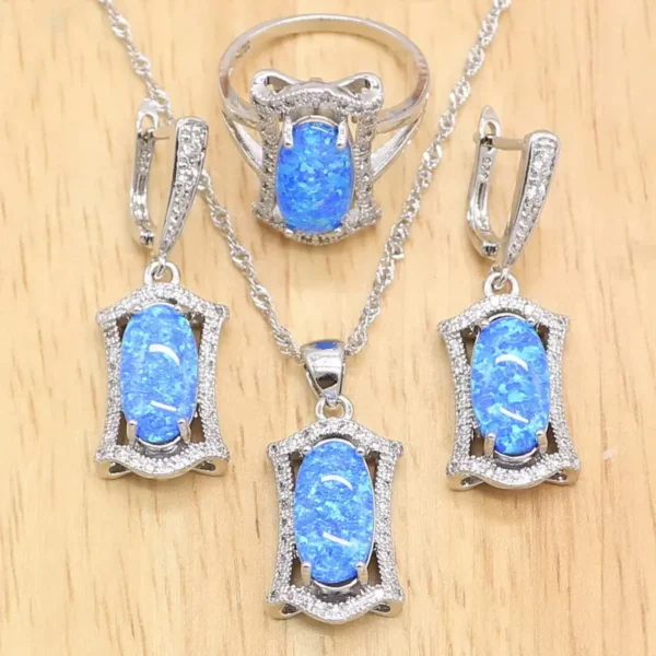 925 Sterling Silver Set, gold-plated with Silver and adorned with Geomertric Blue Opal stones.